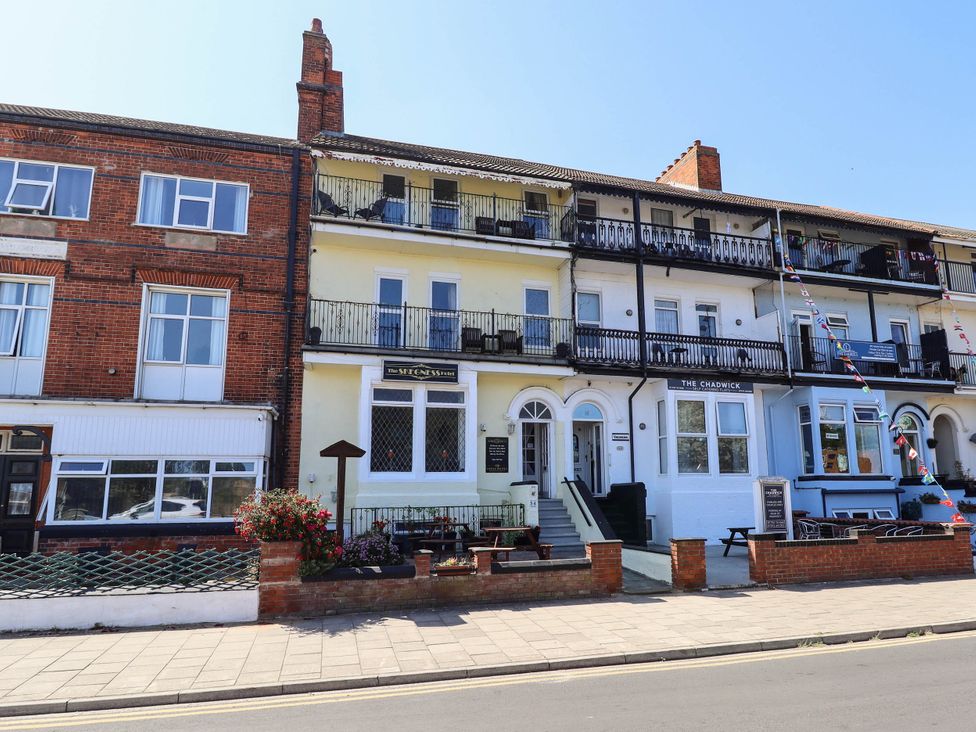 A building with balconies and signage at The Skegness Hotel in Skegness