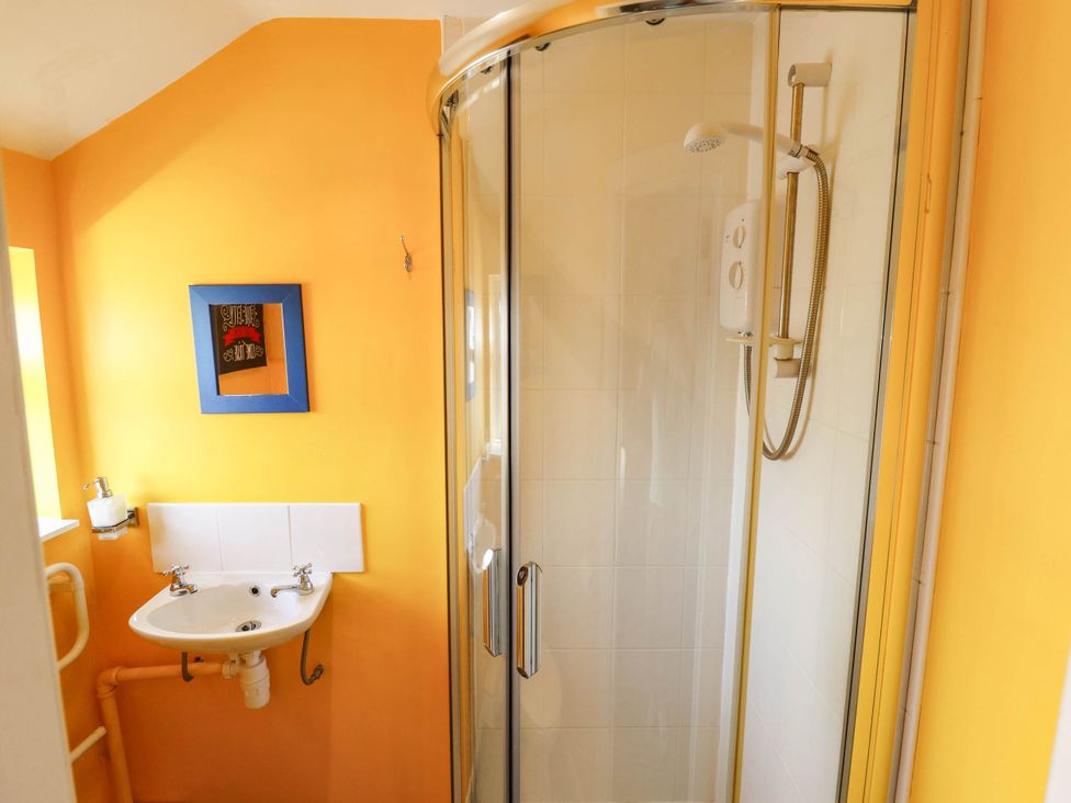 A bathroom with a shower and sink at The Skegness Hotel in Skegness