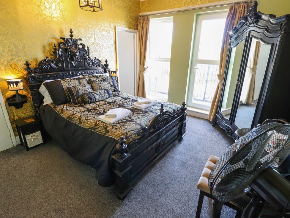 A bedroom with a bed and furniture at The Skegness Hotel in Skegness
