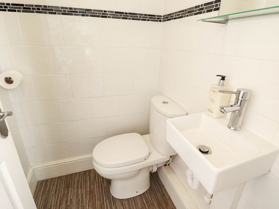 A bathroom with a toilet and sink at The Skegness Hotel in Skegness