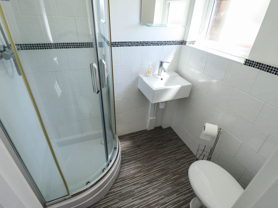 A bathroom with a shower and sink at The Skegness Hotel in Skegness