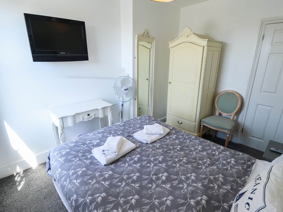 A bedroom with a bed and television at The Skegness Hotel in Skegness