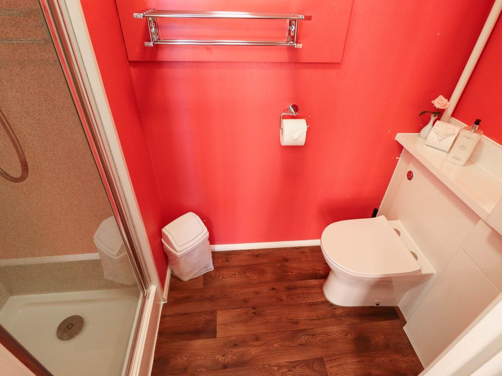 A bathroom with a shower and toilet at The Skegness Hotel in Skegness