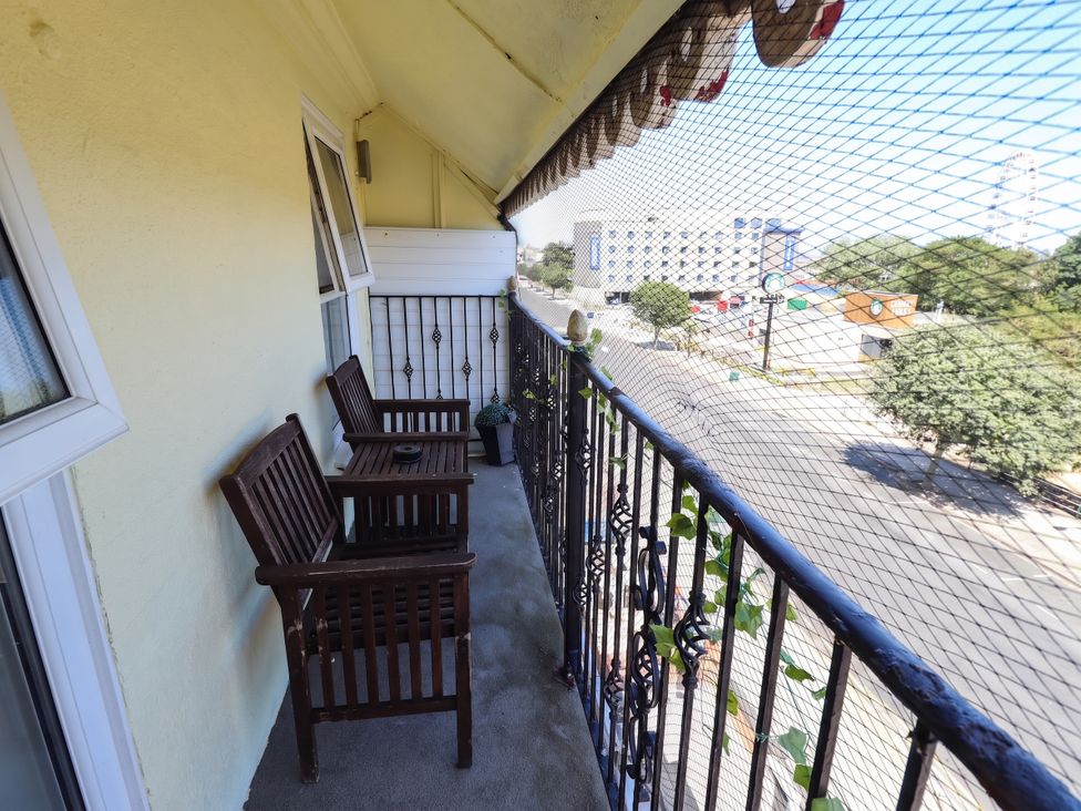 A balcony with chairs and a planter at The Skegness Hotel in Skegness