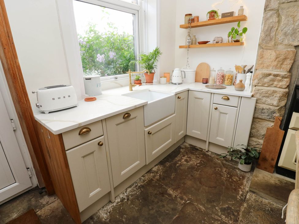 A kitchen with a sink and appliances at 10 Park Road