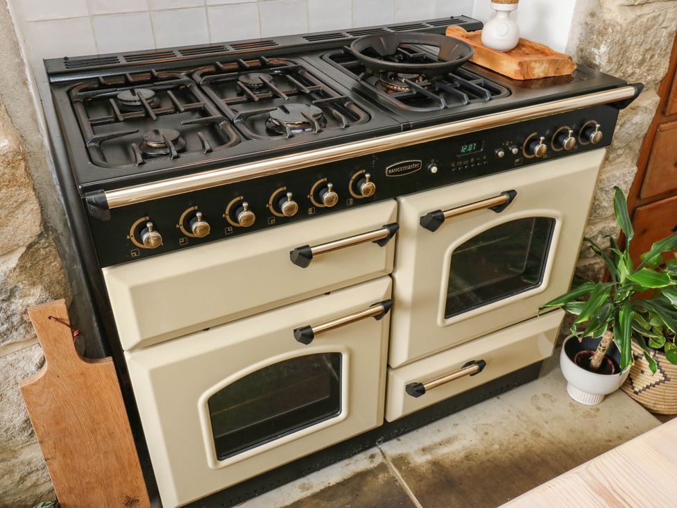 A stove with gas burners and two ovens at 10 Park Road