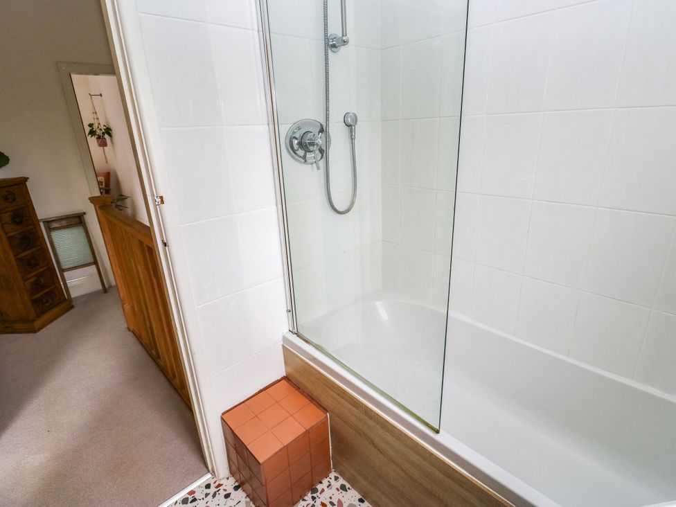 A shower and bathtub in a bathroom at 10 Park Road Cowling