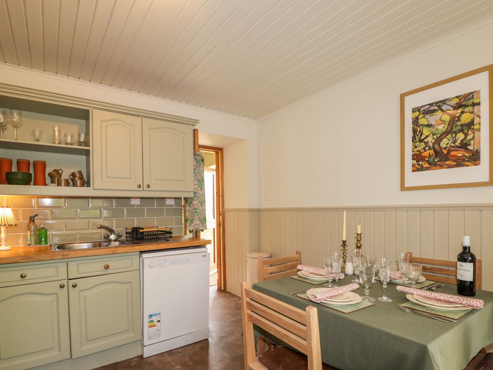 A kitchen with a table set for dining at Gairnshiel School House near Ballater