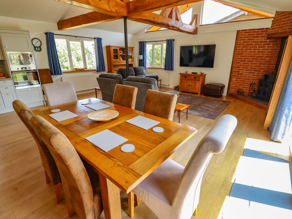 A dining room with a table and chairs at 80 Pentney Lakes in Pentney near King's Lynn