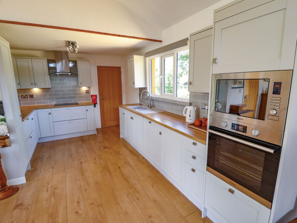A kitchen with a sink and oven at 80 Pentney Lakes near King's Lynn