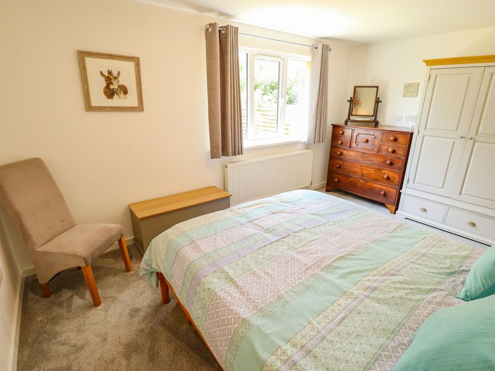 A bedroom with a bed and chest of drawers at 80 Pentney Lakes, Pentney near King's Lynn