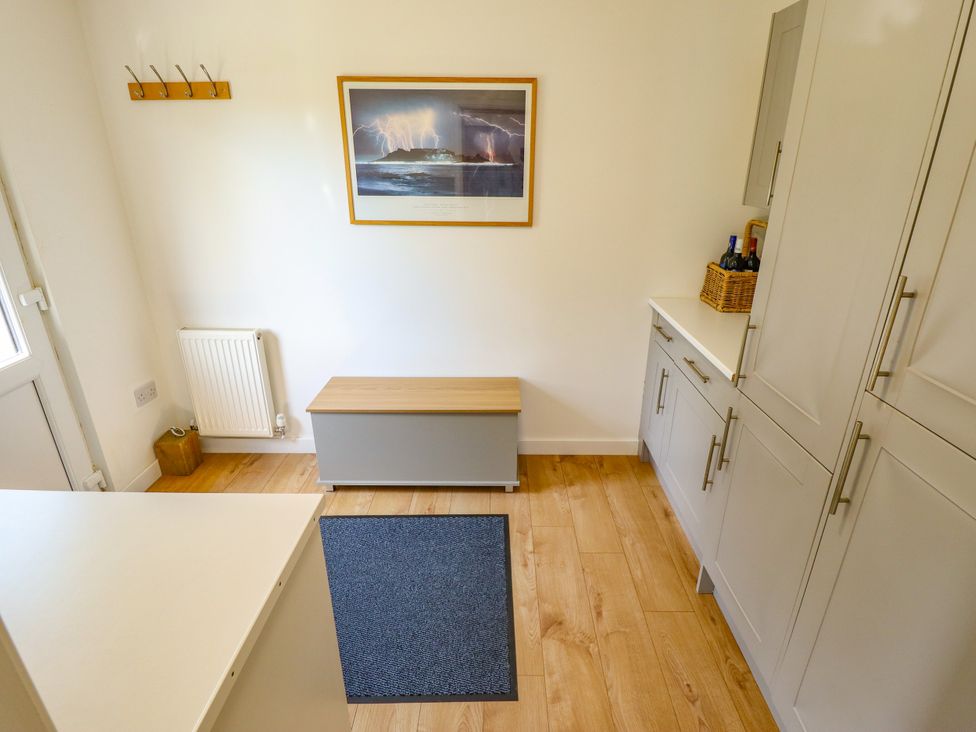 A utility room with a bench and cabinets at 80 Pentney Lakes, Pentney near King's Lynn