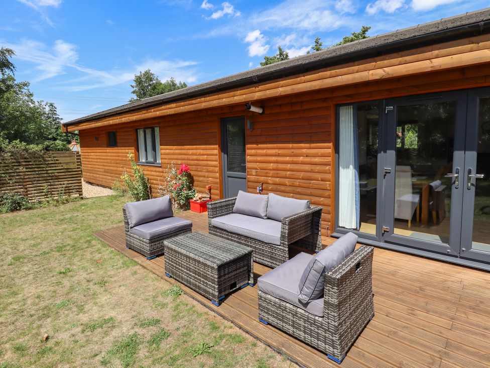 A patio area with seating at 80 Pentney Lakes in Pentney near King's Lynn