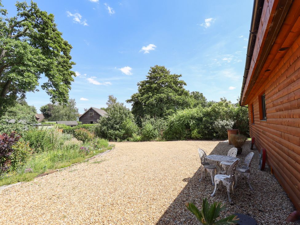 A garden area with a table and chairs at 80 Pentney Lakes in Pentney near King's Lynn