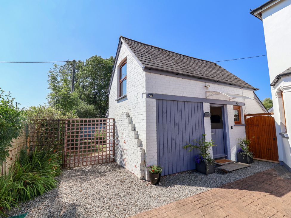 A house exterior with a gate and pathway at Coach House Highampton near Black Torrington