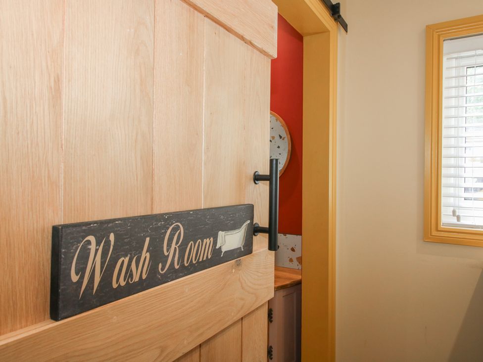 A wash room entrance door at The Dinky Dairy in Treflach near Trefonen