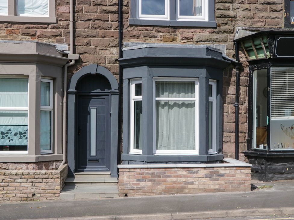 A house front with a door and windows at 24 Harrington Road, Workington