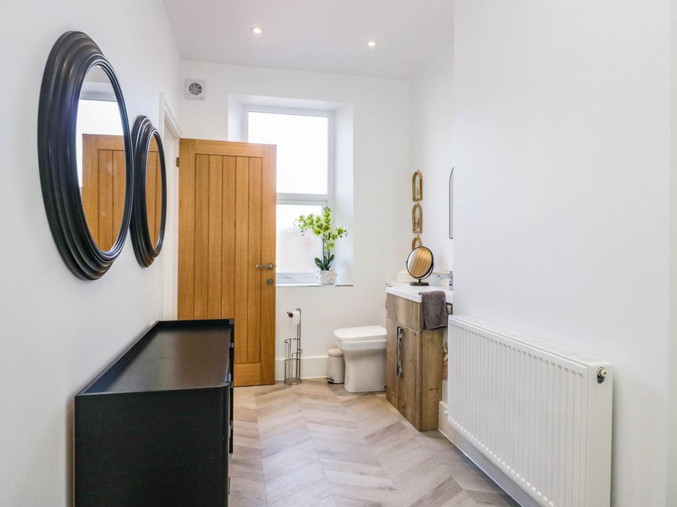 A bathroom with a sink and toilet at 24 Harrington Road Workington