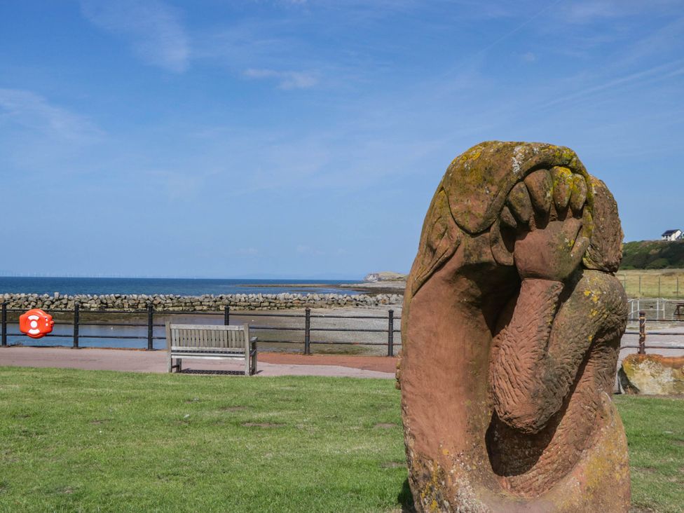 A hand sculpture near an ocean view at 24 Harrington Road in Workington