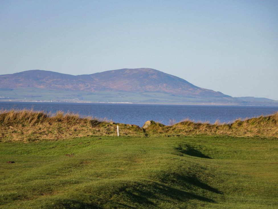 A landscape view with a mountain and water at 24 Harrington Road Workington