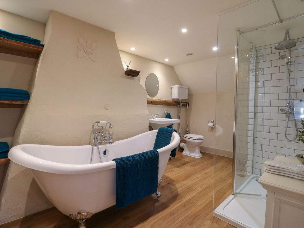 A bathroom featuring a bathtub, toilet, and shower at The Annex in Cavendish Near Sudbury