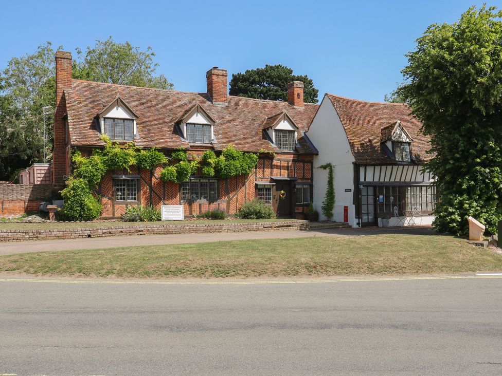 A building with multiple sections and garden at The Annex Cavendish Near Sudbury