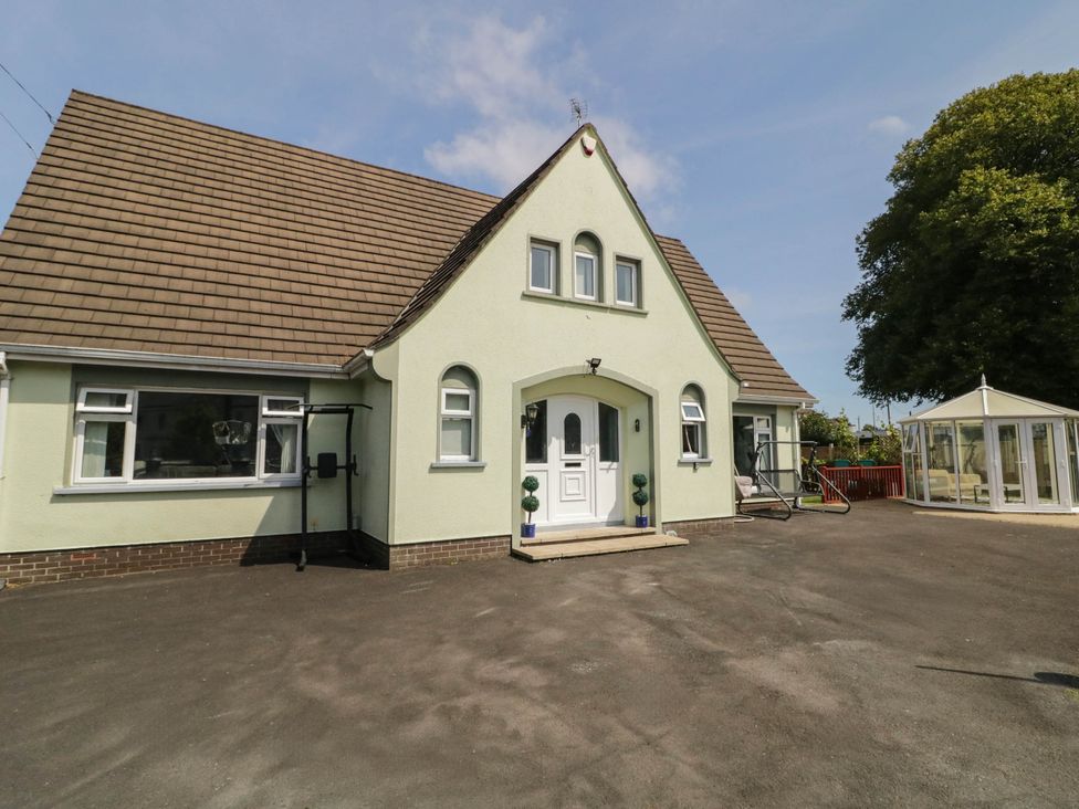 A house with a front yard and a conservatory at 59 Nursery Avenue in Coleraine