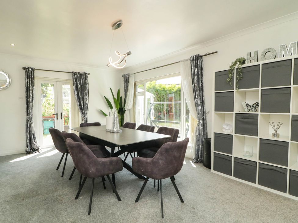 A dining room with a table and chairs at 59 Nursery Avenue in Coleraine