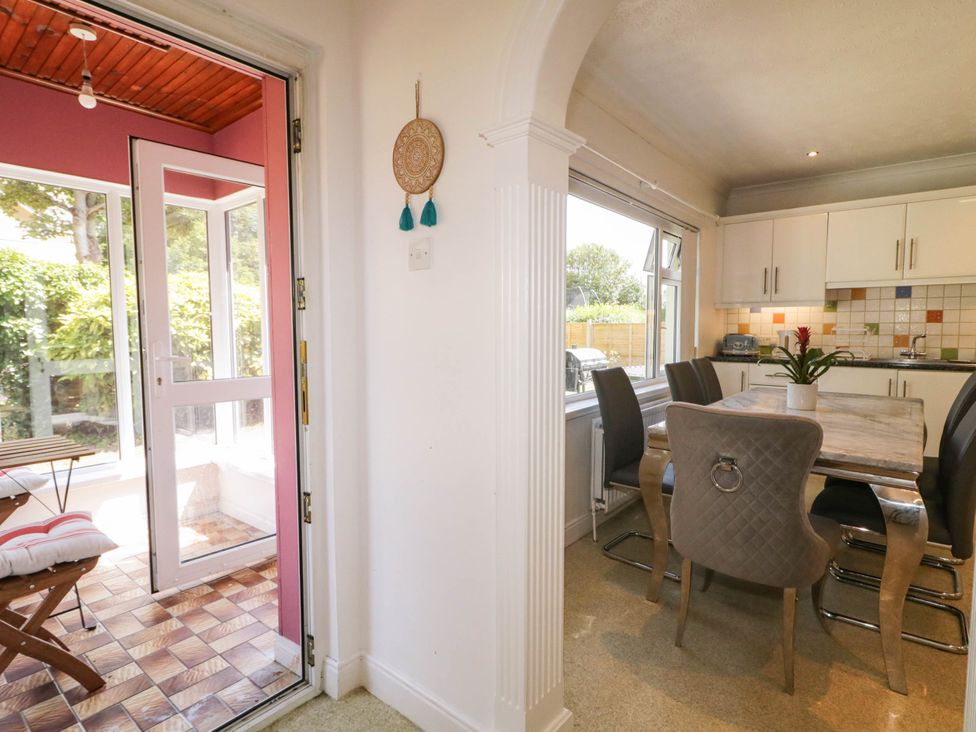 A kitchen with a dining table and chairs at 59 Nursery Avenue Coleraine