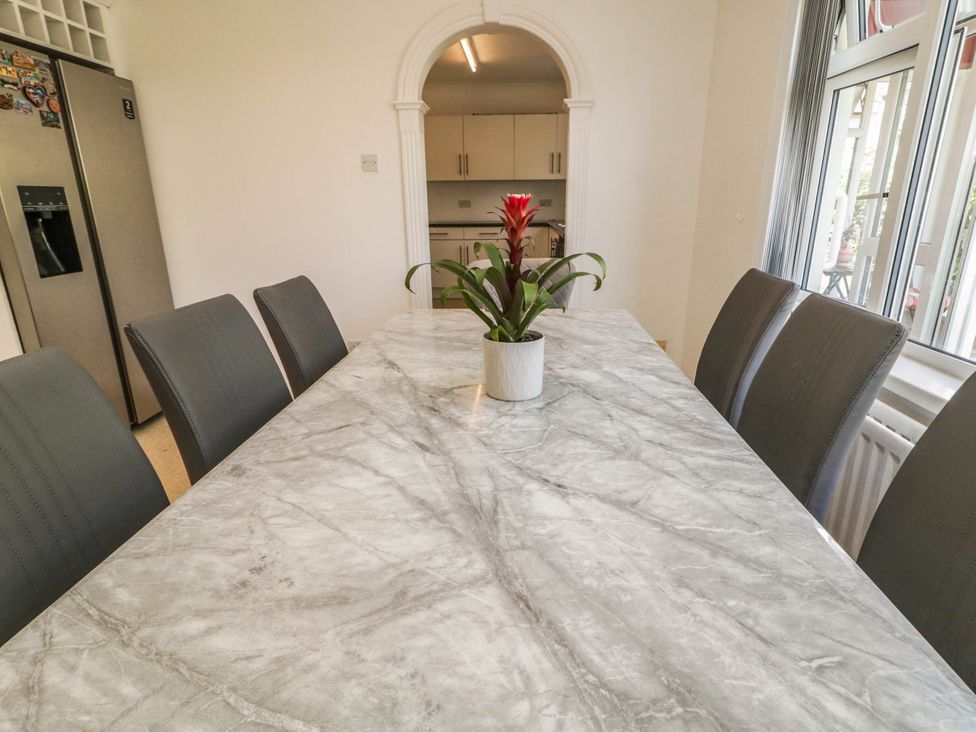 A kitchen with a table and chairs at 59 Nursery Avenue Coleraine