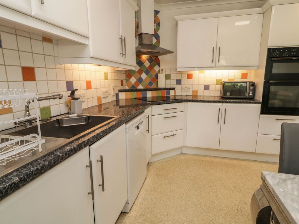 A kitchen with sink and appliances at 59 Nursery Avenue Coleraine