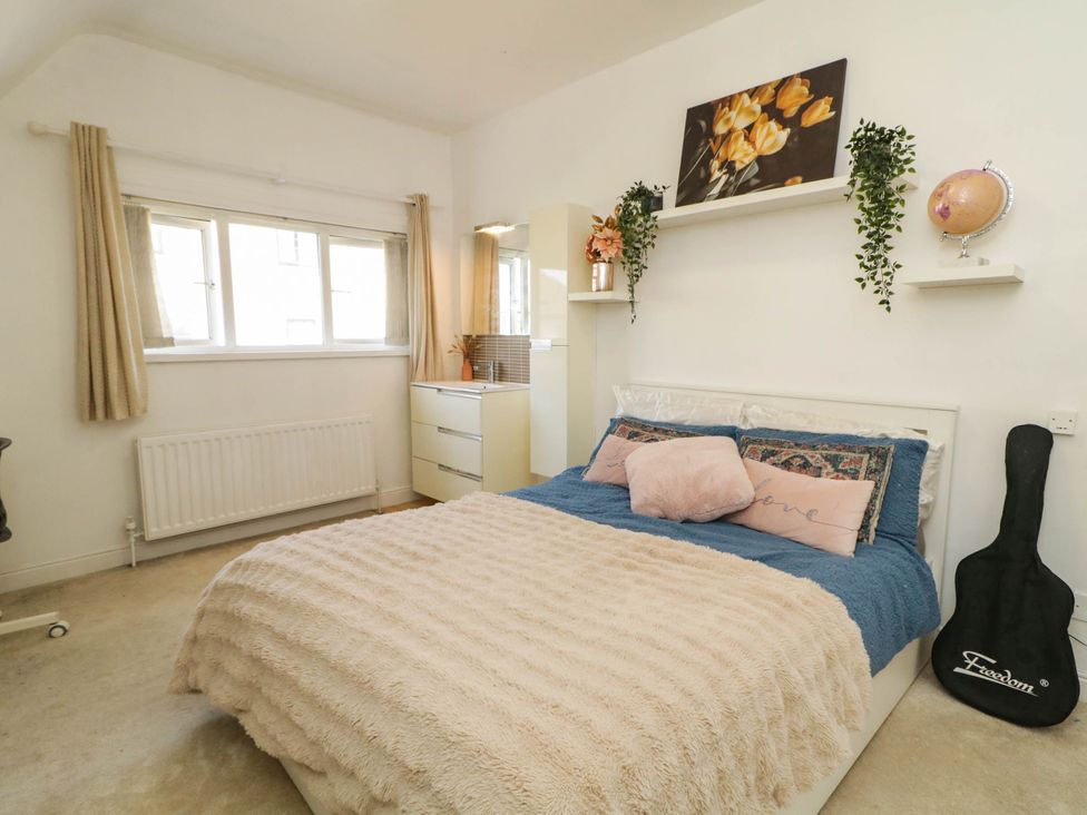 A bedroom with a bed and dresser at 59 Nursery Avenue in Coleraine