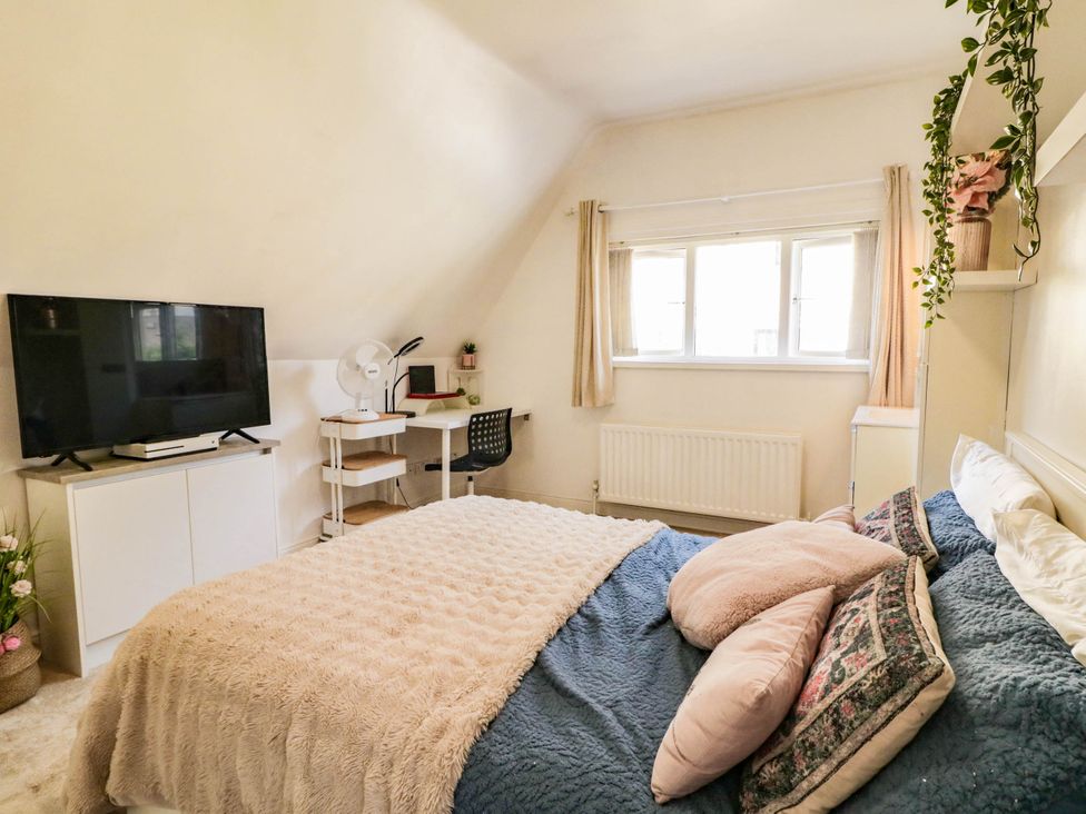 A bedroom with a bed and television at 59 Nursery Avenue in Coleraine