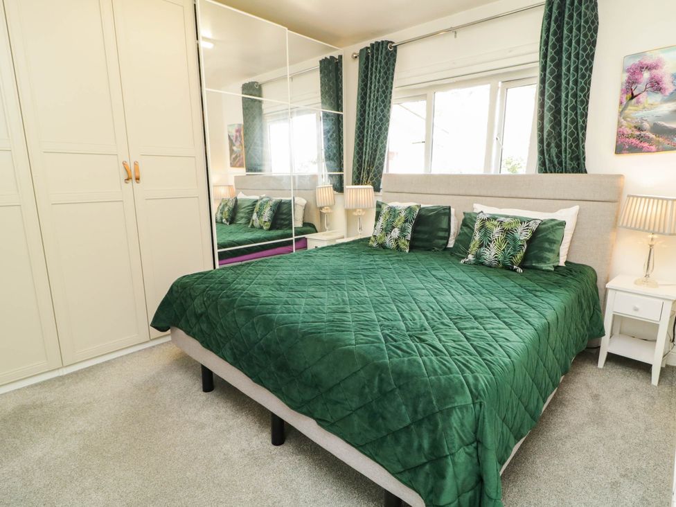 A bedroom with a bed and wardrobe at 59 Nursery Avenue in Coleraine