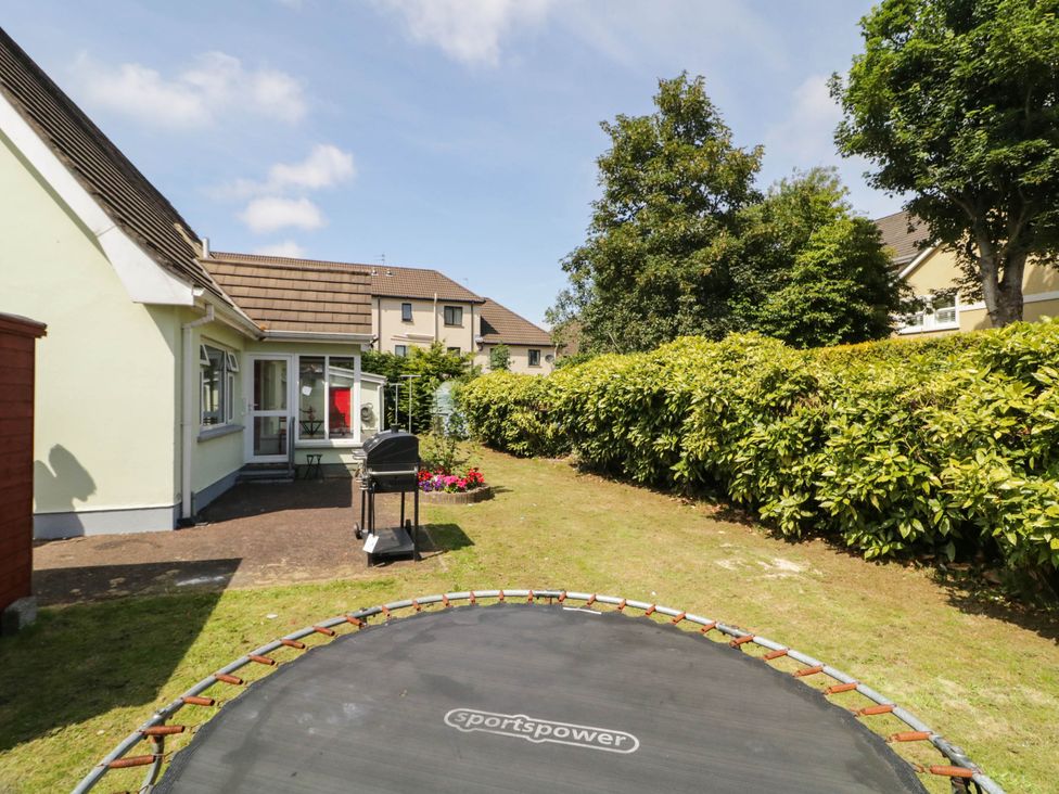 A garden with a trampoline and barbecue grill at 59 Nursery Avenue Coleraine