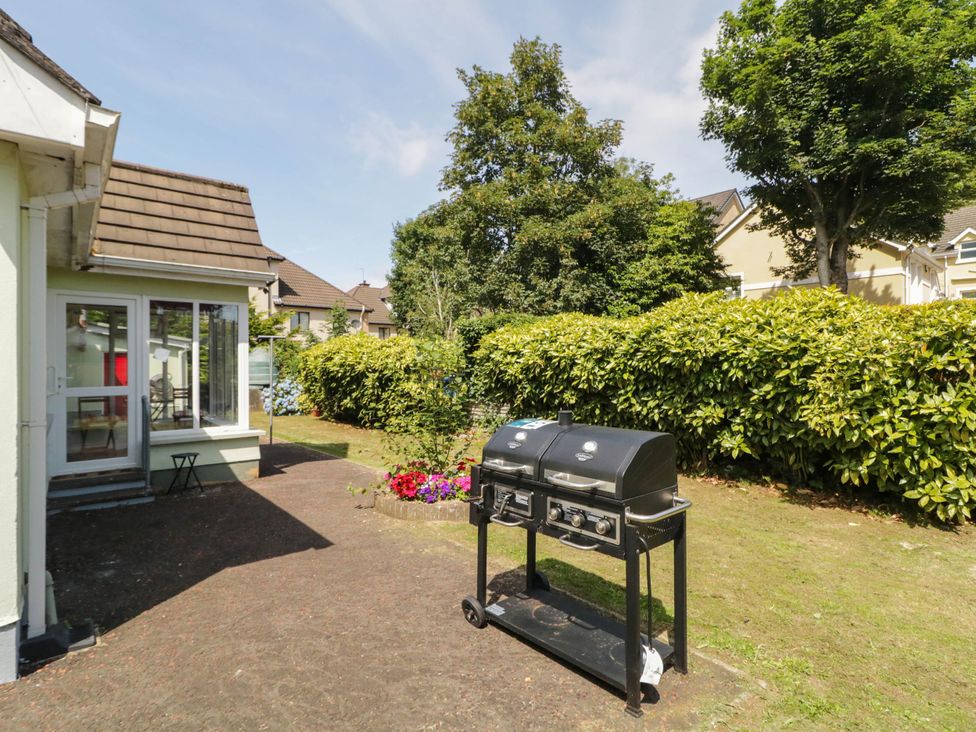 A garden with a grill and flower bed at 59 Nursery Avenue in Coleraine