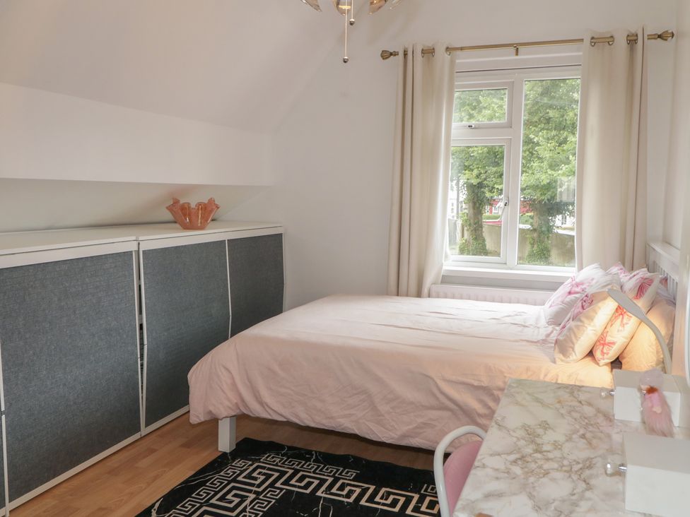 A bedroom with a bed and wardrobe at 59 Nursery Avenue Coleraine