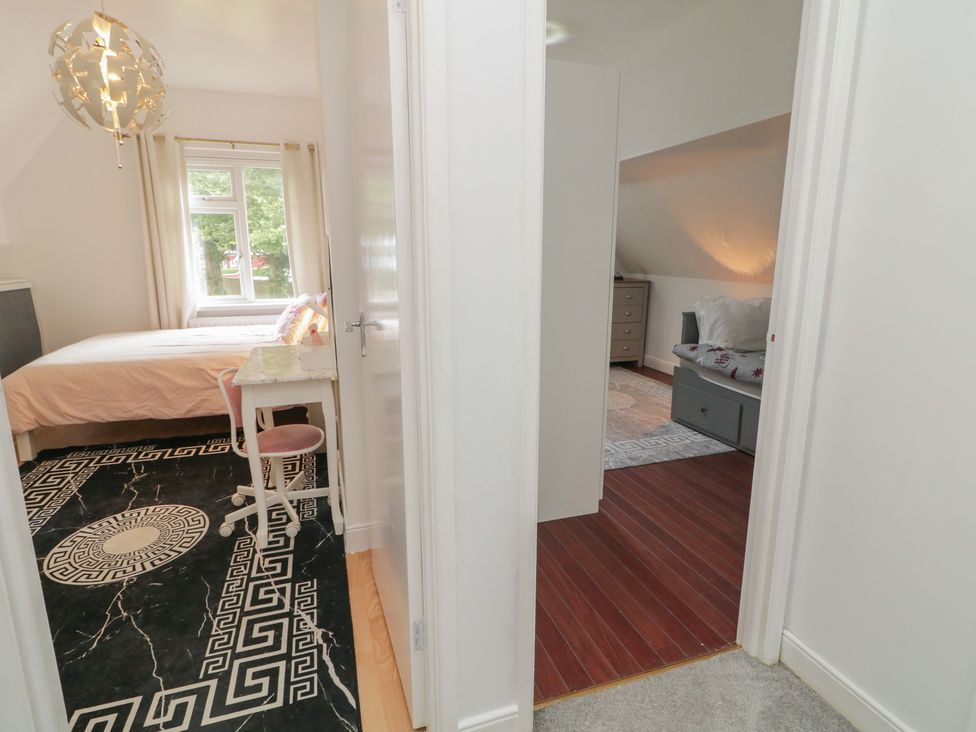A bedroom with a bed and desk viewed from the doorway at 59 Nursery Avenue Coleraine