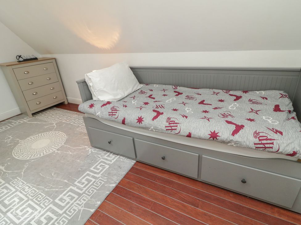A bedroom with a bed and dresser at 59 Nursery Avenue, Coleraine