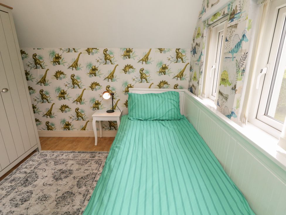 A bedroom with a bed and wardrobe at 59 Nursery Avenue, Coleraine