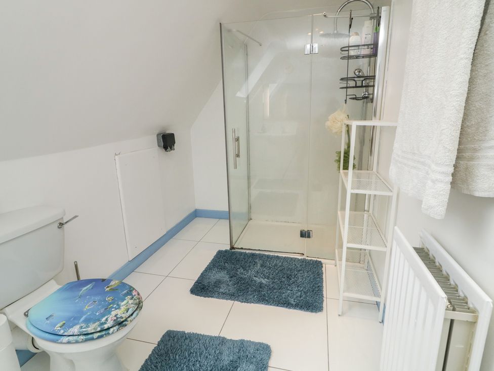 A bathroom with a shower and toilet at 59 Nursery Avenue in Coleraine