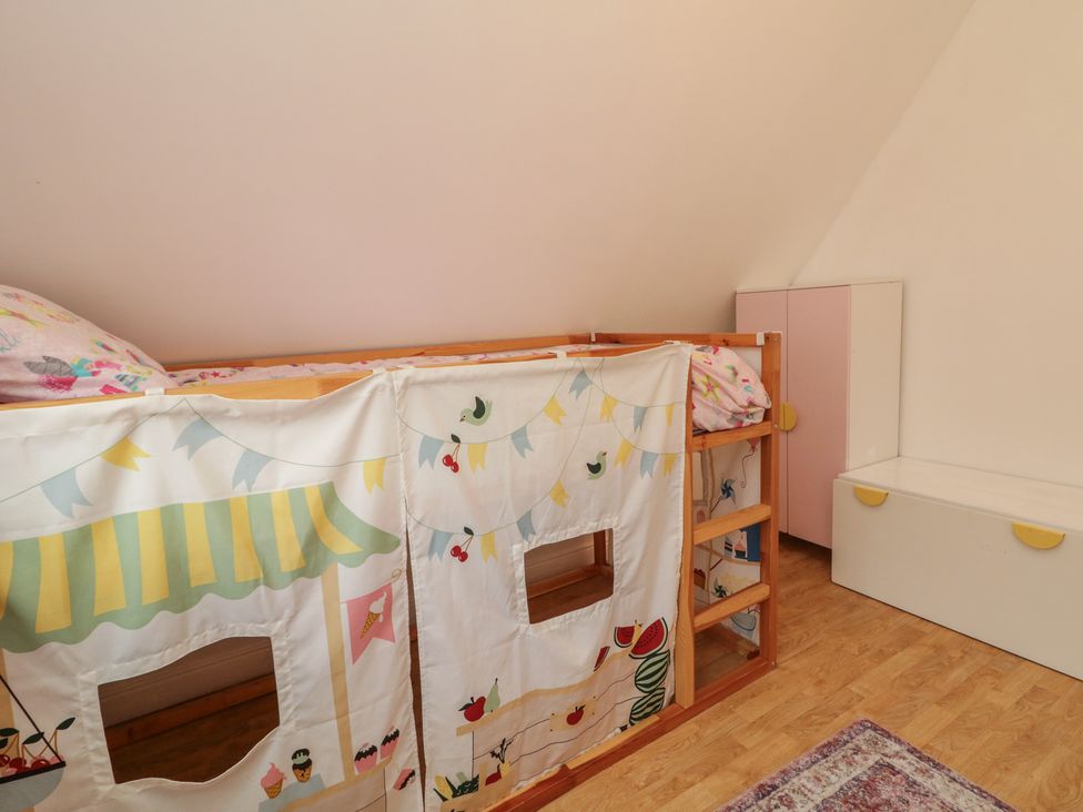 A bedroom with a bunk bed and storage at 59 Nursery Avenue Coleraine