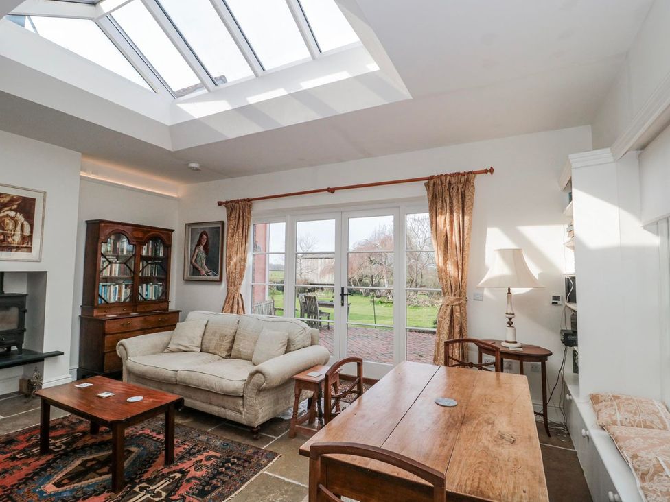 A snug with a sofa and coffee table at Tuxwell Lodge in Bridgwater