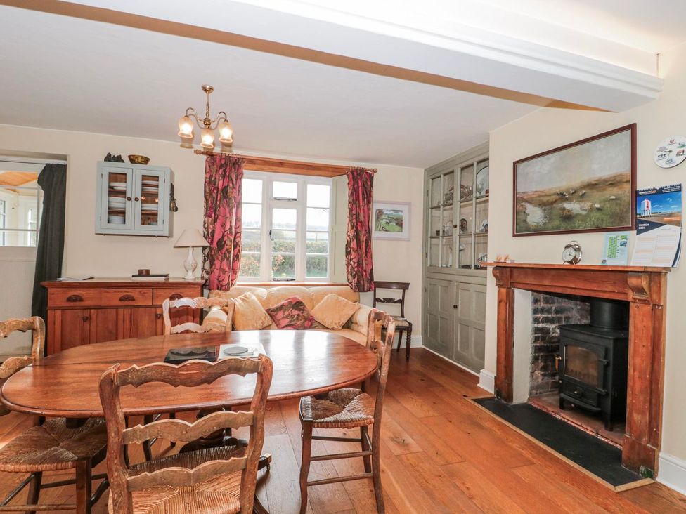 A dining room with a table and chairs at Tuxwell Lodge in Bridgwater