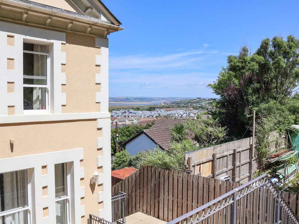 A view of a house with a window overlooking a landscaped area at Sea Vista in Westward Ho!