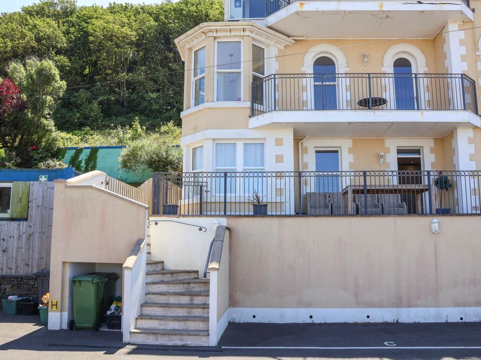 A house with a balcony and stairs at Sea Vista in Westward Ho!