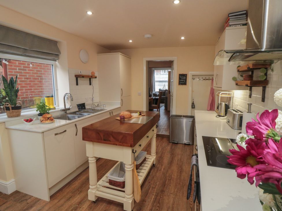 A kitchen with an island and sink at Memory Maker in Bridlington