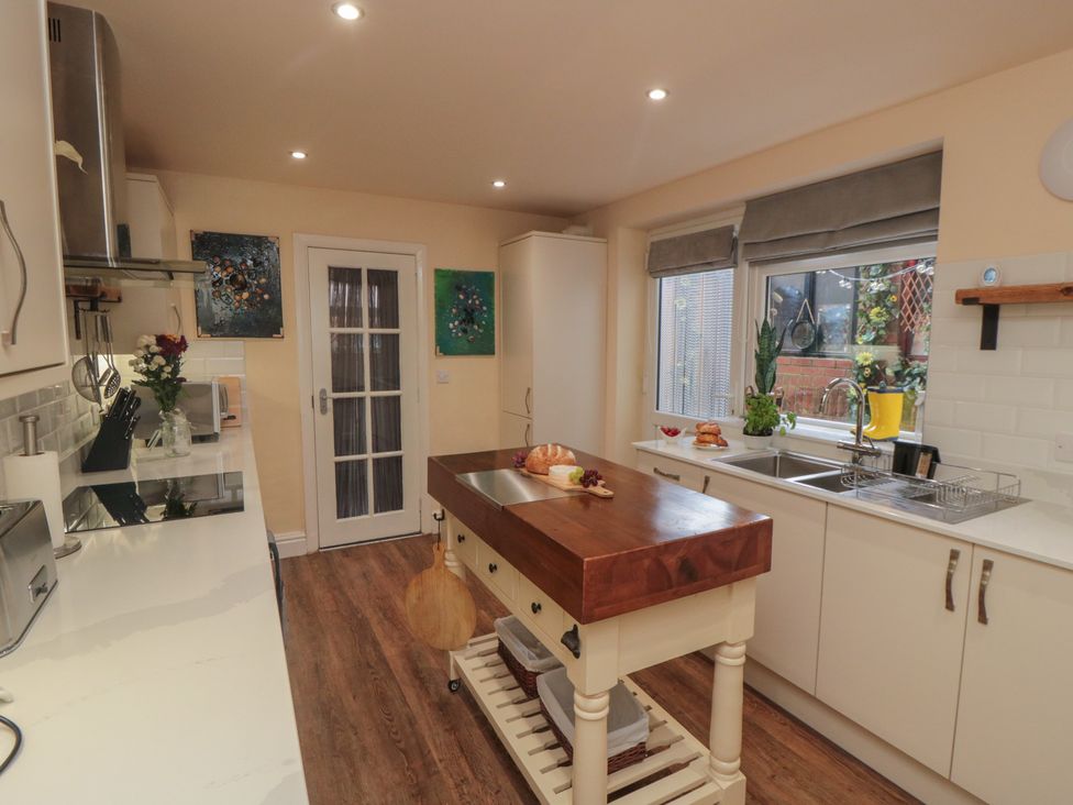 A kitchen with a central island and appliances at Memory Maker in Bridlington
