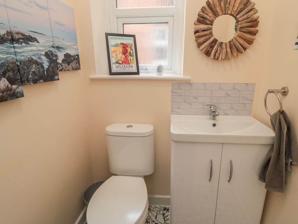 A bathroom with a toilet and sink at Memory Maker in Bridlington