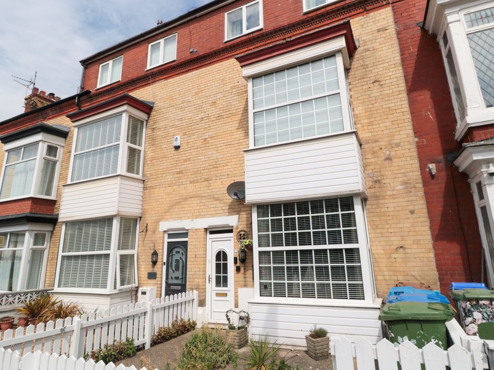 A building facade with windows and a door at Memory Maker in Bridlington